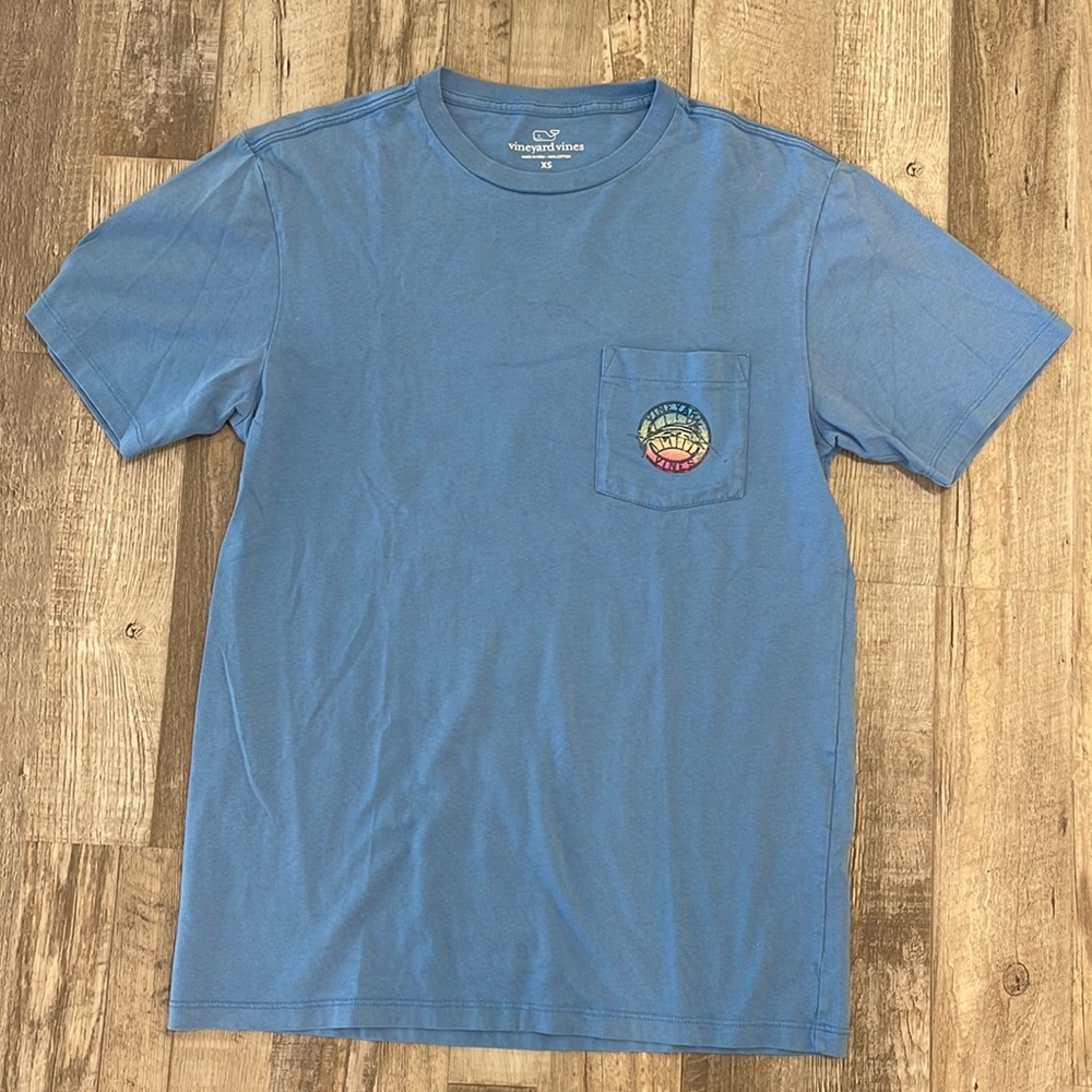 Vineyard Vines Tee XS light blue with Marlin on pocket and back.